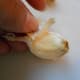 Your garlic clove is now ready to peel. Cut off top and bottom ends. Be careful not to cut too much!