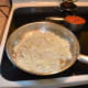 After about 5-7 minutes of cooking in water the onions will be translucent and water will have evaporated.