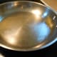 Fill a 10-12 inch stainless steel skillet with 1/4 - 1/2 cup water.