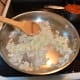 Add onions to skillet and stir. Reduce heat to medium and allow onions to cook until translucent. Stir frequently.