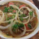 Diced shallots on Vietnamese soup.
