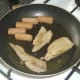 Turkey meat is briefly fried and reheated with sausages