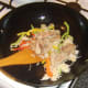 Turkey meat is added to noodles and peppers
