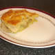 Portion of pork, pineapple and apple pie is plated