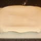 Rolled pastry is carefully laid on pie dish