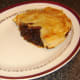 Plated pork and venison pie portion