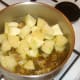 Apple and pineapple are stirred in to cooked and cooled pork