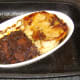 Cutting pork and venison pie to serve