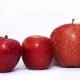 Three different variations of red apples