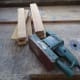 Using an ordinary sander to smooth all the shelf supports.