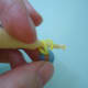 You can also do this step without a loom. Just insert 6 rubber bands one at a time through a cap band (double or triple loop) to get the same result.
