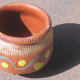 An ice cream pot made of clay in India.