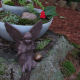 I placed the two-tier garden on an old, mossy stump, then added my fairy figure. She was too big to go directly in the garden.
