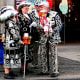 Pearly Kings and Queens in London's Covent Garden. Suits are filled with buttons.