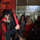 Beezlebub causing trouble, gives a speech on his mischievous exploits