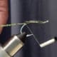 Secure with thread, and then wrap thread to the front