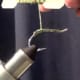 Wrap Sparkle Braid along hook shank, covering the weighted keel in the process