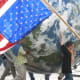 Giant globe and inverted U.S. flag (a signal of distress), anti-war march, Seattle, Washinigton, 27 October 2007.