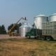 Two trucks are used to block in the bin from wind.