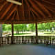 Inside a pavilion looking out at the park