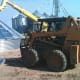 A skid loader makes transportation of bunks of sheets easy and fast. Please allow only experienced skid loader drivers to haul sheets.
