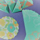 Fold all eight circles into zig zag wedges. Make a smaller contrasting circle for assembling the rosette.