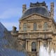 Ancient and modern. Juxtaposition of architecture at the Louvre. The building in the background is the Pavillon Richelieu, part of the north wing of the museum