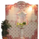 pink and water tile are the backdrop for this Mediterranean style water fountain