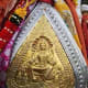 The gold and silver facade or mohra of the idol of Kamru Naag