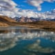 A beautiful reflection of puffy clouds in the Dhankar Lake, located at an altitude of about 14000 feet in Spiti Valley, Himachal Pradesh.