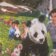 Paintings were displayed of the Bible's wonderful hope of a new world, where children will be able to play with various animals.