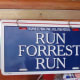 The very popular line from the movie, "Forrest Gump" which helps to inform the waitress of your needs. There is also a red sign that says, "Stop Forrest Stop."