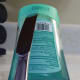 After fully inserting a flat tool as pictured here, move it to either side of the container. Pulling up on the tool will cause the Lysol Healthy Touch refill lid to pop off.