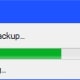 The progress bar will initially display a message that it is estimating the time remaining to restore the backup to your device.