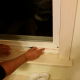 Applying double-sided adhesive tape to the bottom of the window