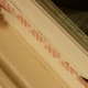 Peeling the front-facing side of the double-sided sealing tape to reveal the adhesive side.