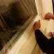 Apply shrink wrap to the window along the path of the adhesive tape, leaving about five inches of overhang. Then cut off the overhang.