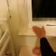 Apply shrink wrap to the window along the path of the adhesive tape, leaving about five inches of overhang. Then cut off the overhang.