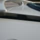 Bent in half the frame of my trunk and pulled my spoiler out.