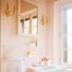 pink bathroom with white fixtures