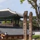 Korean carved poles in a traditional village.