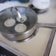 Poached eggs cooking on the stove
