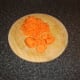 One carrot is grated, the other is sliced
