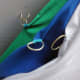 Three colour screens, green, blue and white back drops hanging from loft.
