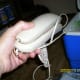 Regular phone. Cell phones will be out, and if you have a wireless land line, it will be out to as long as the electricity is out. Usually the regular phone service is one of the first services back up and running after a storm.