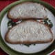 Slices of Graubrot spread with margarine.