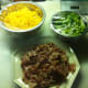 Grated cheese, chopped green onions, chopped cooked bacon