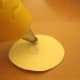 Applying glue to the circle.
