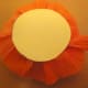Circle glued onto crepe paper roll.
