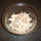 Chicken is picked from bones in large flakes